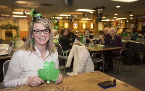 Bridgette Hampton, The Irish Association of Manitoba event's coordinator and club member, admits people to the clubs for the all day St. Patricks Day party on Erin Street in Winnipeg on Monday, March 17, 2014. The club is offering a variety of entertainment, such as dancers, musicians, bag pipers, drinks and food, all day long until close at 1:30 a.m. (Crystal Schick/Winnipeg Free Press)