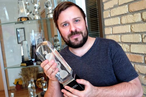 Grant Paley holding a Juno award that was given to Serena Ryder for her 2013 Adult Alternative Album of the Year. Grant is an agent for Paquin Entertainment, a giant agency/management company based in Winnipeg. 140317 - March 17, 2014 MIKE DEAL / WINNIPEG FREE PRESS