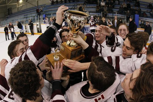 March 17, 2014 - 140317  -  St Paul's Crusaders celebrate a 4-1 win over the River East Kodiaks in the AAAA Provincial High School Hockey Championship at St James Arena, March 17, 2014. John Woods / Winnipeg Free Press