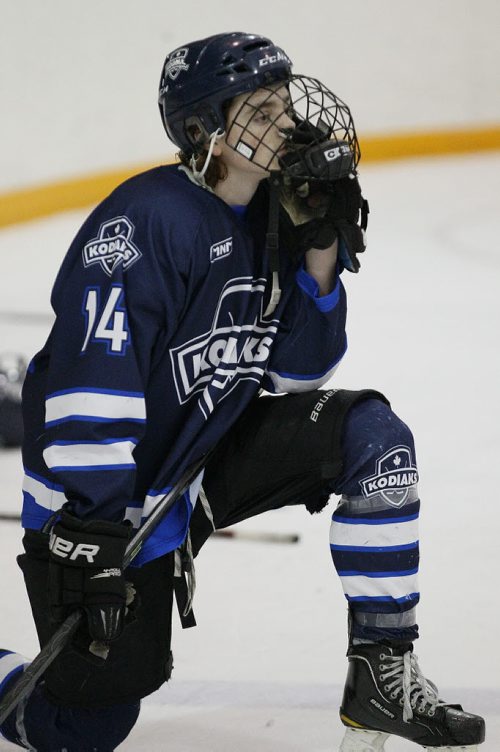 March 17, 2014 - 140317  -  River East Kodiaks Brady Valiquette (14) reacts after losing  4-1 to the St Paul's Crusaders in the AAAA Provincial High School Hockey Championship at St James Arena, March 17, 2014. John Woods / Winnipeg Free Press