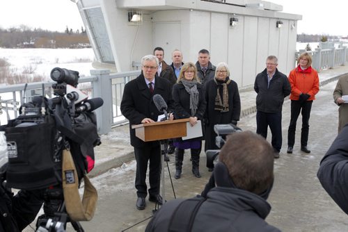 Manitoba Premier Greg Selinger addresses the media at the Floodway inlet control structure.  Completion of the Red River Floodway expansion project came in under budget. BORIS MINKEVICH / WINNIPEG FREE PRESS  March 18, 2014