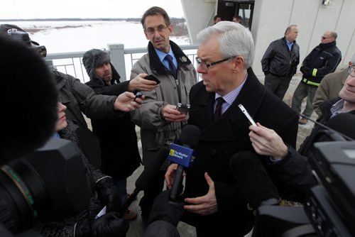 Manitoba Premier Greg Selinger addresses the media at the Floodway inlet control structure.  Completion of the Red River Floodway expansion project came in under budget. BORIS MINKEVICH / WINNIPEG FREE PRESS  March 18, 2014