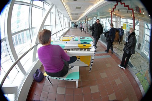 The Piano Project Erna Wiens is  the first Winnipeger to play this donated piano in a public space, on the overhead walkway between Portage Place and The Bay Tuesday afternoon for the Downtown Biz's new initiative called Play Your Part  - Piano Project.  Seven donated pianos were fixed up and painted by artists at Studio 393 and are being placed in various public spaces throughout downtown Winnipeg for members of the public to enjoy at will. See Story. March 18, 2014 Ruth Bonneville / Winnipeg Free Press