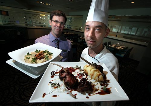 Blue Marble Food and Beverage Manager Brett Crellin (left) and Chef Anthony Kucera hold Cavena Risotto and Lamb Duo repectively. See Marion Warhaft's review. March 18, 2014 - (Phil Hossack / Winnipeg Free Press)