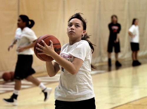 Sisler High's Zeralyn Panesa homes in on the hoop at a team workout Tuesday evening. See Ed Tait story. March 18, 2014 - (Phil Hossack / Winnipeg Free Press)