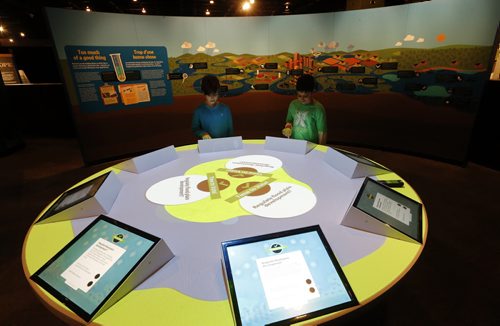 LtoR , Jacob Block age 8 and Dhruv Joshi age 9 get look at the interactive exhibit ,Lake Winnipeg Shared Solutions Exhibit opens March 22  at the Manitoba Museum with the  aim to educate  the public about is threatened body of water and how to  fix the lake , story by brat kives Mar. 19 2014 / KEN GIGLIOTTI / WINNIPEG FREE PRESS