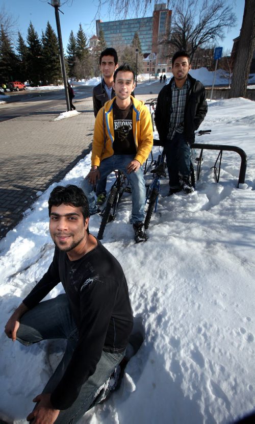 Shahrukh Altaf (front) and left to right, Saif Ali, Kabir Kang (in yellow) and Ehtisham Rauf pose at U of M Wednesday. International students survive their first winter and are excited for spring! See story. March 19, 2014 - (Phil Hossack / Winnipeg Free Press)