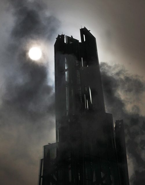 Sun emerges through fog and heating exhaust behind a silhouette of the Tower of Hope ( which stands nearly 100 m high) atop the Canadian Museum for Human Rights Thursday  The top of the Tower of hope is nearly -, 2014   (JOE BRYKSA / WINNIPEG FREE PRESS)