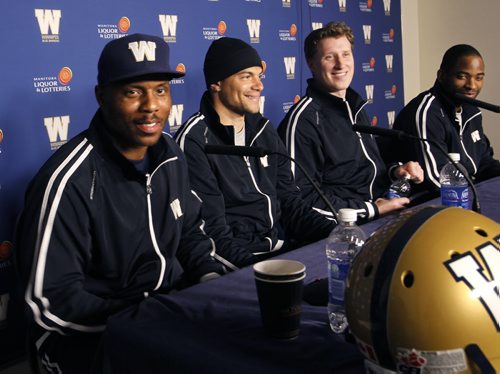 Winnipeg Blue Bombers players from left,  defensive back Korey Banks,  wide receiver  Nick Moore, quarterback Drew Willy and wide receiver Cory Watson at press conference at Investors  Group Field Thursday.   Melissa Martin  story.    Wayne Glowacki / Winnipeg Free Press March 20   2014