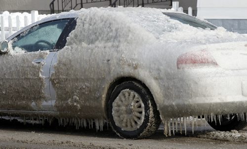 From the ice age into the first day of spring Thursday. Iced car parked on Mountain Ave. Thursday morning.    Wayne Glowacki / Winnipeg Free Press March 20   2014