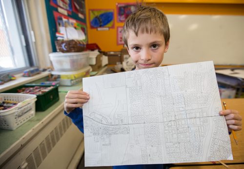 Fifth grader at Brock Corydon School, Jeremiah Rohne, shows of his "ideal Winnipeg map" as part of his classes "C" Winnipeg project in Winnipeg on Thursday, March 20, 2014. In partnership with Tourism Winnipeg and Take Pride Winnipeg, Susan Pereles' fifth and sixth grade classes have become ìchild ambassadorsî by studying the history, culture and unique aspects that make them proud to be from Winnipeg. (Photo by Crystal Schick/Winnipeg Free Press)