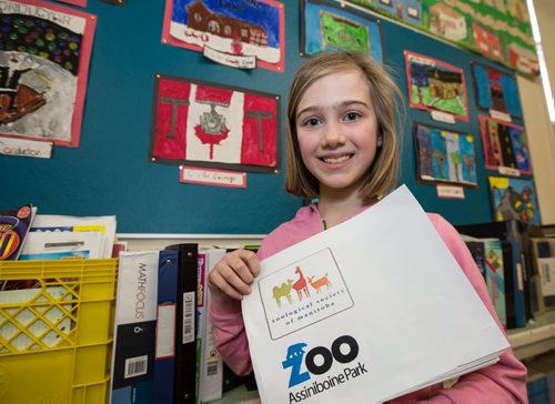 Sixth grader at Brock Corydon School, Abigail Rowan, poses with her Assiniboine Park inquiry project, which is part of her classes "C" Winnipeg project in Winnipeg on Thursday, March 20, 2014. In partnership with Tourism Winnipeg and Take Pride Winnipeg, Susan Pereles' fifth and sixth grade classes have become ìchild ambassadorsî by studying the history, culture and unique aspects that make them proud to be from Winnipeg. (Photo by Crystal Schick/Winnipeg Free Press)