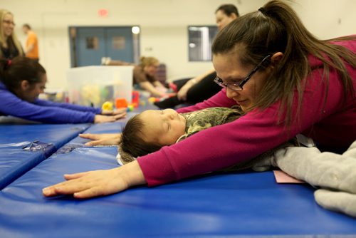 The Boldness Project - 49.8 section Wendy Hallgrimson, attends a Mom and Me exercise program at St. John's CC with her  2 month old baby boy Lindal Zebrasky. Wendy Hallgrimson, her partner James Zebrasky coddle  and their 2 month old baby boy Lindal Zebrasky  are part of this new initiative to change the stats on literacy and health in First Nations children living in the North End. See story. March 20, 2014 Ruth Bonneville / Winnipeg Free Press
