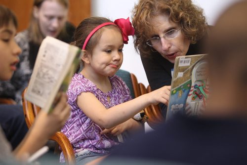 Six year old Claudia Sanderg  reads with volunteer lawyer Brenda Silver  at West Broadway Youth Outreach during the Lawyers Helping Kids Read Literacy event Saturday.  March 22, 2014 Ruth Bonneville / Winnipeg Free Press