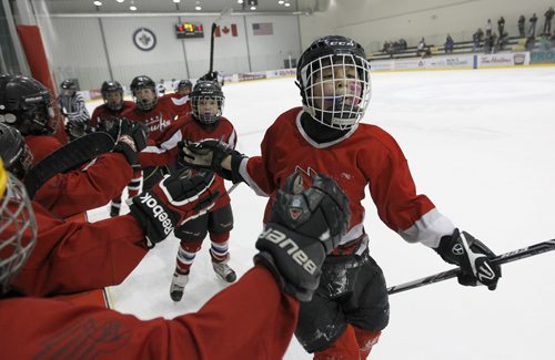 Peyton Moneyas of the Sagkeeng Hawks celebrates after scoring late in the game against the OCN Blizzard during the 27th Annual Aboriginal Minor Hockey Tournament at MTS Iceplex, Saturday, March 22, 2014. Fifty-seven teams from more than 10 communities are represented. (TREVOR HAGAN/WINNIPEG FREE PRESS)