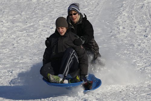 March 23, 2014 - 140323  - Daniel (L) and William Friesen were out sledding with their friend Nathan Devine at Kilcona Park Sunday, March 23, 2014. John Woods / Winnipeg Free Press