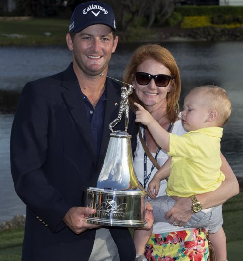 Matt Every, left, his wife Danielle and their son Liam pose with the trophy after the Arnold Palmer Invitational golf tournament at Bay Hill, Sunday, March 23, 2014, in Orlando, Fla. (AP Photo/Willie J. Allen Jr.)