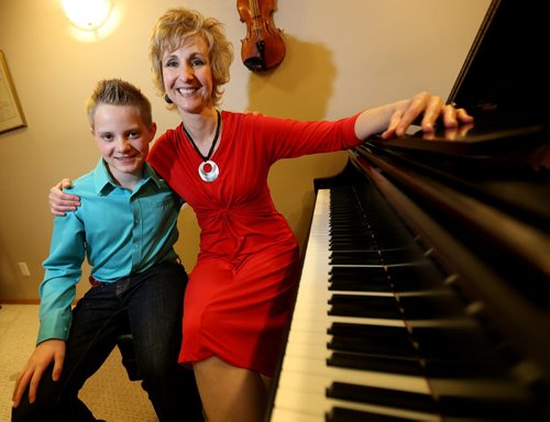 Pianist, Raymond Guerard, 12, with his teacher, Jacqueline Ryz, at her piano studio, Sunday, March 22, 2014. Raymond will be performing for Juno artists as they arrive at the airport. (TREVOR HAGAN/WINNIPEG FREE PRESS) - for jen zoratti