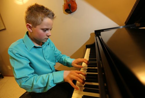 Pianist, Raymond Guerard, 12, at his teachers studio, owned by Jacqueline Ryz, Sunday, March 22, 2014. Raymond will be performing for Juno artists as they arrive at the airport. (TREVOR HAGAN/WINNIPEG FREE PRESS) - for jen zoratti