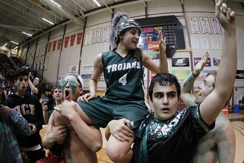 March 24, 2014 - 1401  -  Vincent Massey Trojans and MVP Atoosa Jalayeri (4) celebrates a win over the Sisler Spartans in the MHSAA AAAA Provisional Basketball Championships at the University of Manitoba Monday, March 24, 2014. John Woods / Winnipeg Free Press