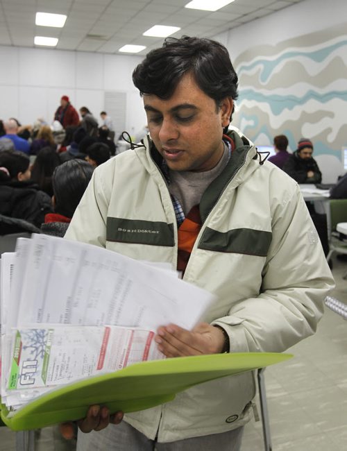Vaibhav Saija was among the  dozens of people that wait in the auditorium in the Norquay Building with all their receipts for the free tax services  thats meant to help poor people get their tax refunds. Mary Agnes Welch story  Wayne Glowacki / Winnipeg Free Press March 25   2014