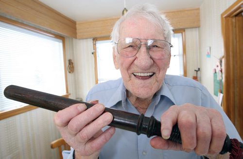 Oldest living Winnipeg police officer, soon-to-to-be 99-year-old Ken Hansell has a laugh with his billy club- See Gordon Sinclair story- Mar 25, 2014   (JOE BRYKSA / WINNIPEG FREE PRESS)