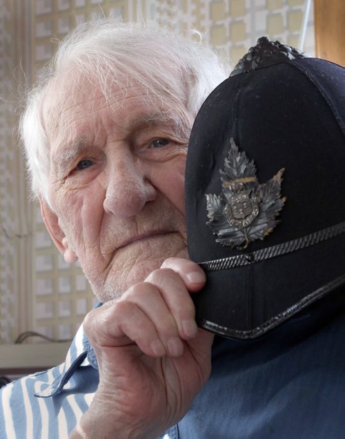 Oldest living Winnipeg police officer, soon-to-to-be 99-year-old Ken Hansell.- with his original police helmet- See Gordon Sinclair story- Mar 25, 2014   (JOE BRYKSA / WINNIPEG FREE PRESS)