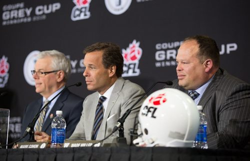 The Hon. Greg Selinger, from left, Premier of Manitoba, Mark Cohon, commissioner Canadian Football League, and Wade Miller, president and CEO of the Winnipeg Blue Bombers, at a conference announcing the 2015 Winnipeg Grey Cup hosting at Investors Group Field in Winnipeg on Wednesday, March 26, 2014. (Photo by Crystal Schick/Winnipeg Free Press)