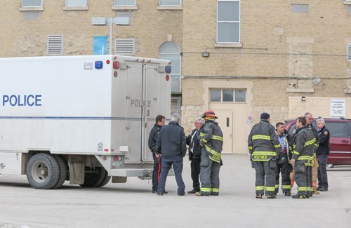 A suspicious backpack found at St. Boniface College caused the evacuation of the school and put Winnipeg emergency crews and bombsquad to work establishing what was in the backpack in Winnipeg on Wednesday, March 26, 2014. Constable Jason Michalyshen, public information officer for the Winnipeg police department, said that the suspicious backpack contained a commercial grade drill. The owner of the backpack and drill has not been identified. (Photo by Crystal Schick/Winnipeg Free Press)