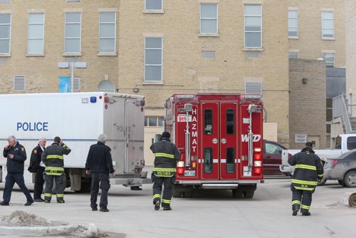 A suspicious backpack found at St. Boniface College caused the evacuation of the school and put Winnipeg emergency crews and bombsquad to work establishing what was in the backpack in Winnipeg on Wednesday, March 26, 2014. Constable Jason Michalyshen, public information officer for the Winnipeg police department, said that the suspicious backpack contained a commercial grade drill. The owner of the backpack and drill has not been identified. (Photo by Crystal Schick/Winnipeg Free Press)
