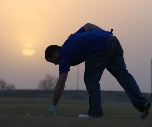 Spring Found- Sioux Falls, South Dakota- Michael Thompson,  enjoys 15C weather at the Prairie Green Golf Course Wednesday evening in a t-shirt at the driving range-    See Randy Turner find spring story- March 26, 2014   (JOE BRYKSA / WINNIPEG FREE PRESS)