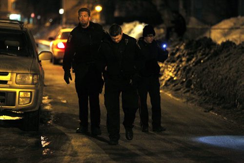 Late night police scene on Young Street near Sargent Ave.  BORIS MINKEVICH / WINNIPEG FREE PRESS  March 26, 2014
