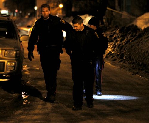 Late night police scene on Young Street near Sargent Ave.  BORIS MINKEVICH / WINNIPEG FREE PRESS  March 26, 2014