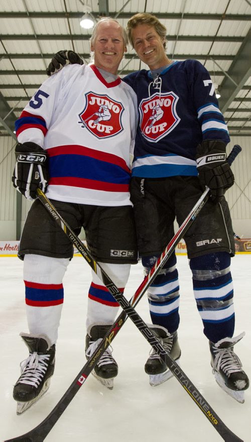 Mark Napier, left, captain for the NHLers, and Jim Cuddy, captain for the Rockers, get ready to practice with their respective teams for the Juno Cup at the MTS Iceplex in Winnipeg on Thursday, March 27, 2014. (Photo by Crystal Schick/Winnipeg Free Press)