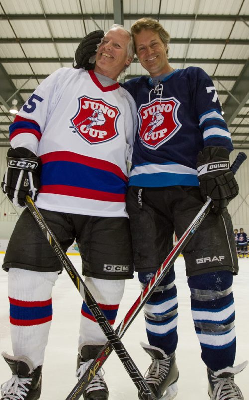 Mark Napier, left, captain for the NHLers, and Jim Cuddy, captain for the Rockers, get ready to practice with their respective teams for the Juno Cup at the MTS Iceplex in Winnipeg on Thursday, March 27, 2014. (Photo by Crystal Schick/Winnipeg Free Press)