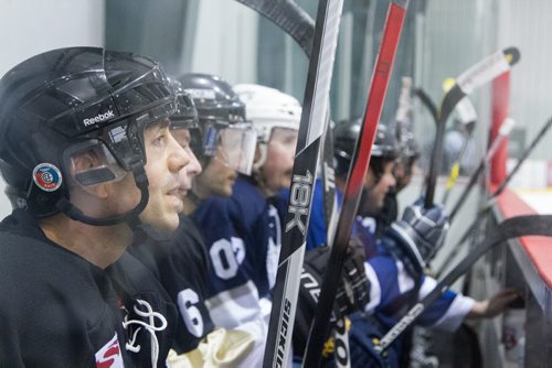 After warming up, Rockers and NHLers mix jerseys and teams to practice together for the annual JUNO Cup at the MTS Iceplex in Winnipeg on Thursday, March 27, 2014. (Photo by Crystal Schick/Winnipeg Free Press)