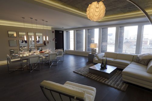 Living room  dining room looking out over Portage Ave near MainSt. ,BIZ / Financee Commercial  Real Estate Page ,5 story commercialbuildingg , condo development of the  Dreman Blg. 238 Portage Ave . Story by Murray McNeill Mar. 28 2014 / KEN GIGLIOTTI / WINNIPEG FREE PRESS