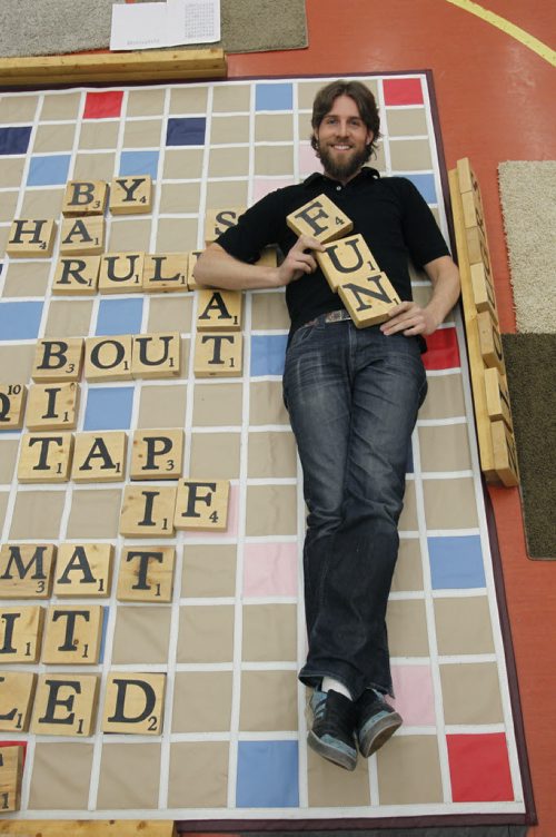 49.8 Intersection. Sean Strachan,  the founder of Big Games, an enterprise that builds big games. In photo, he is with his Big Word game played by students at Lord Selkirk School.   Dave Sanderson story.   Wayne Glowacki / Winnipeg Free Press March 28   2014