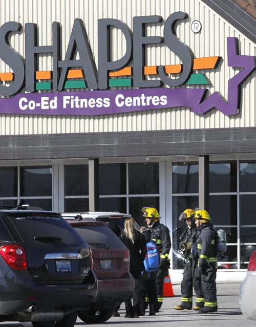 Winnipeg Fire Fighters standby after the strip mall on Nairn Ave. with the Shapes fitness centre was evacuated after the smell of gas was noticed. Wayne Glowacki / Winnipeg Free Press March 28   2014