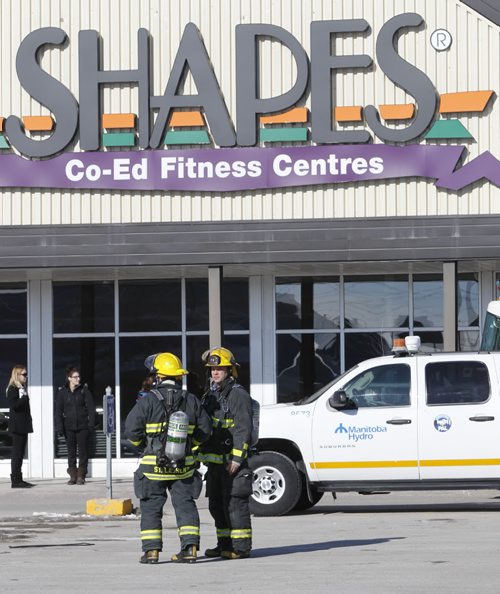 Winnipeg Fire Fighters standby after the strip mall on Nairn Ave. with the Shapes fitness centre was evacuated after the smell of gas was noticed. Wayne Glowacki / Winnipeg Free Press March 28   2014