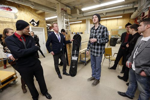 biz ,  ( left holding snow board) is RRC's Scott MacAulay  with snow board maker Matt Olson ( in plaid shirt and touque  spaking centre right) at Assent Works .The second annual Startup Bus Crawl on March 28th. Two buses full of students who are exploring an entrepreneurial lifestyle will visit WinnipegÄôs innovation hotspots. Scott MacAulay is head of Red River CollegeÄôs entrepreneur program. Martin Cash | Business Reporter/ Columnist Mar. 28 2014 / KEN GIGLIOTTI / WINNIPEG FREE PRESS