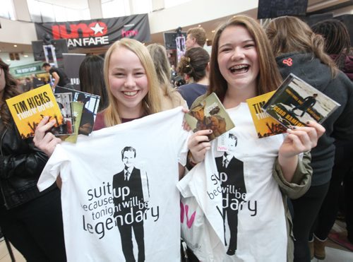 Seventeen year old Richelle Peters (left) and her friend Shianne Johnson - sixteen, waited patiently near the front of the stage at centre court  for 3 hours  Saturday with their CD's and shirts waiting for their favourite country artists to hit the stage at St. Vital Centre Saturday.   March 29, 2014 Ruth Bonneville / Winnipeg Free Press
