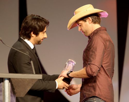 Host Jian Ghomeshi presents the first award to Dean Brody for Country Album of the Year at the 2014 Juno Gala at the Winnipeg Convention Centre, Saturday, March 29, 2014. (TREVOR HAGAN/WINNIPEG FREE PRESS)