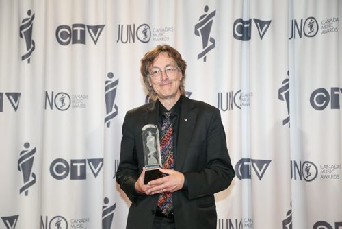Allan Gordon Bell accepts the JUNO for Classical Composition of the Year with Field Notes at the RBC Convention Centre in Winnipeg on Saturday, March 29, 2014. (Photo by Crystal Schick/Winnipeg Free Press)