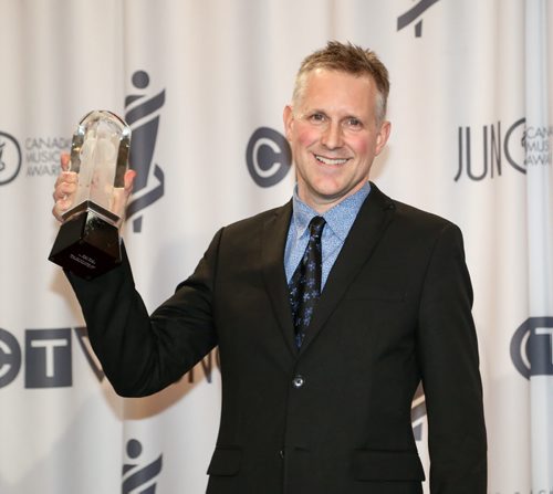 Mike Downes receives the 2014 JUNO for Traditional Jazz Album of the Year with Ripple Effect at the RBC Convention Centre in Winnipeg on Saturday, March 29, 2014. (Photo by Crystal Schick/Winnipeg Free Press)