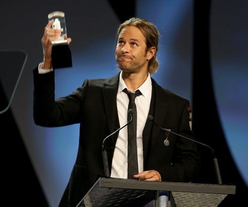 Trevor Guthrie accepts the Juno after he and Armin van Buuren won the Juno for Dance Recording of the Year, at the 2014 Juno Gala at the Winnipeg Convention Centre, Saturday, March 29, 2014. (TREVOR HAGAN/WINNIPEG FREE PRESS)