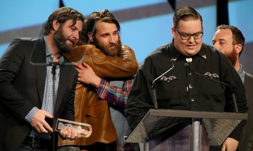 The Strumbellas get emotional as they accept the Juno for Roots & Traditioanl Album of the Year: Gropu at the 2014 Juno Gala at the Winnipeg Convention Centre, Saturday, March 29, 2014. (TREVOR HAGAN/WINNIPEG FREE PRESS)