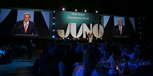 Dr. Lloyd Axworthy presented Chantal Kreviazuk and Raine Maida with the Allan Waters Humanitarian Award at the 2014 Juno Gala at the Winnipeg Convention Centre, Saturday, March 29, 2014. (TREVOR HAGAN/WINNIPEG FREE PRESS)