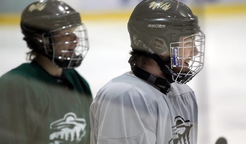 Zach Court, (left) and Mark Taraschuk together at a Winnipeg Wild workout Monday at the IcePlex. See story. March 31, 2014 - (Phil Hossack / Winnipeg Free Press)