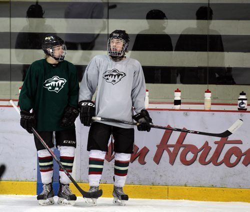 Zach Court, (left) and Mark Taraschuk together at a Winnipeg Wild workout Monday at the IcePlex. See story. March 31, 2014 - (Phil Hossack / Winnipeg Free Press)